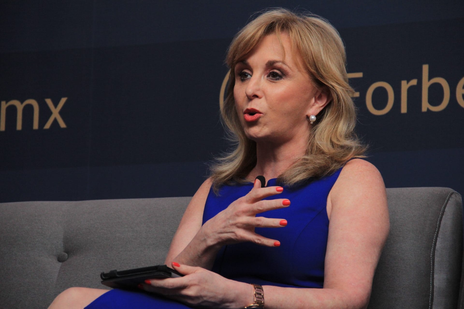 Blanca Treviño, Softtek CEO, in a blue dress